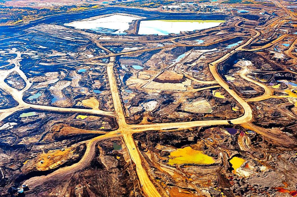 Aerial view of tar sands extraction landscape showing large-scale environmental destruction
